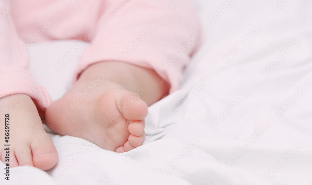 close up little foots of sleeping cute baby close up little foots of sleeping cute baby