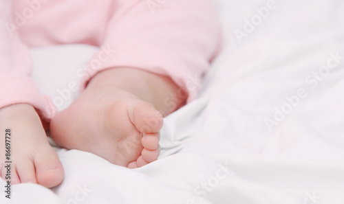close up little foots of sleeping cute baby