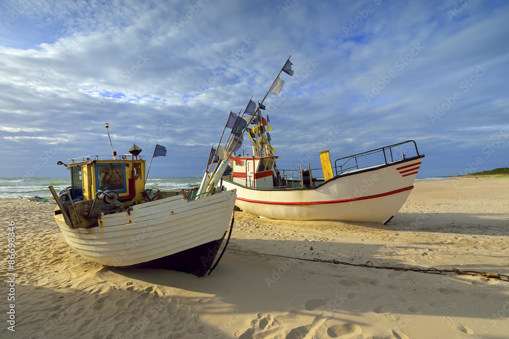 Small fishing boat, on the beach, of Baltic sea, Poland