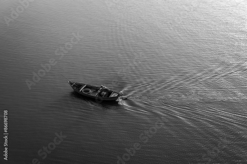 The boat in the river. B&W
