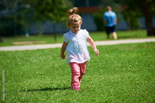 little girl have fun in park