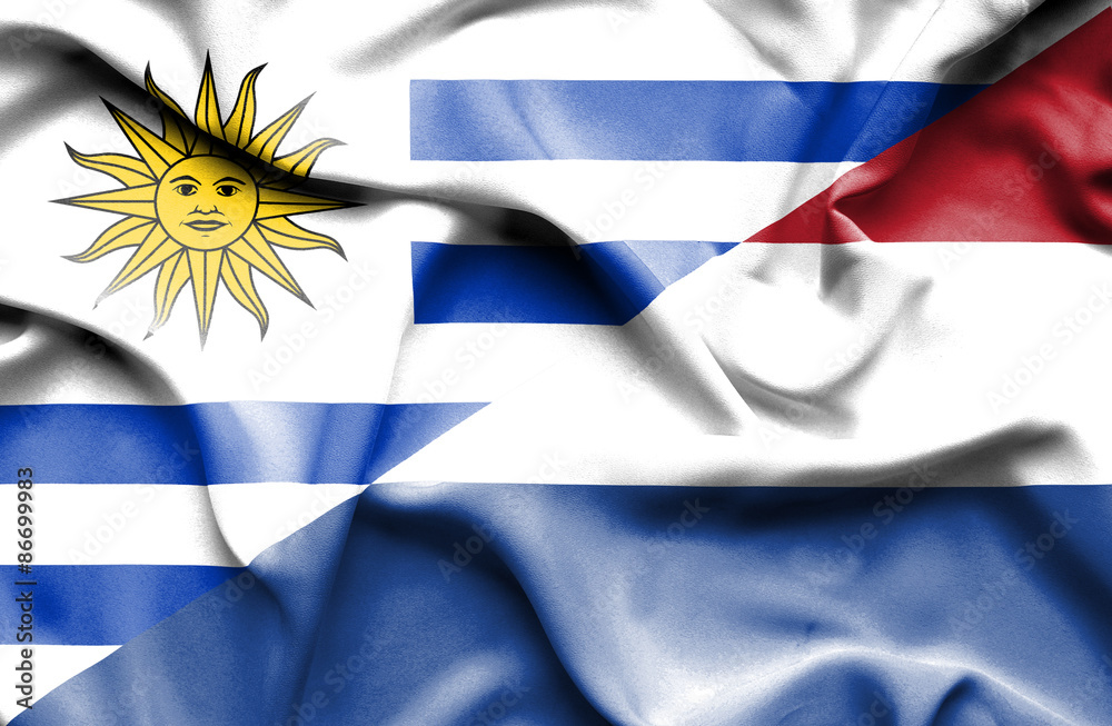 Fototapeta premium Waving flag of Netherlands and Uruguay