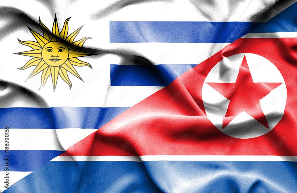 Waving flag of North Korea and Uruguay Waving flag of North Korea and Uruguay