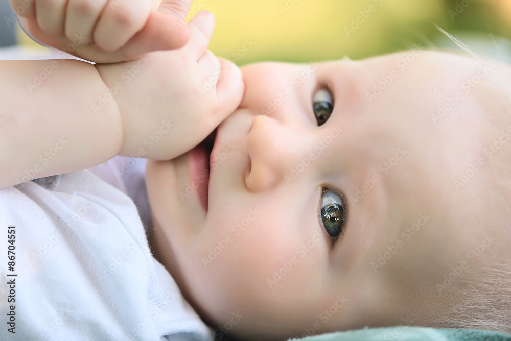 Closeup photo of adorable baby in park