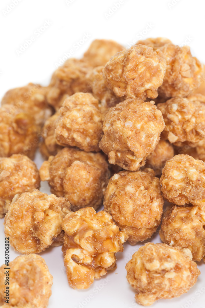 Almond and caramal popcorn on white background Almond and caramal popcorn on white background
