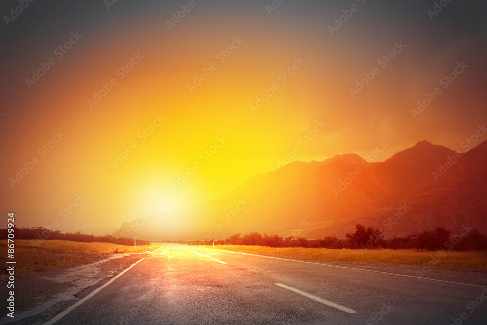Sunset above road