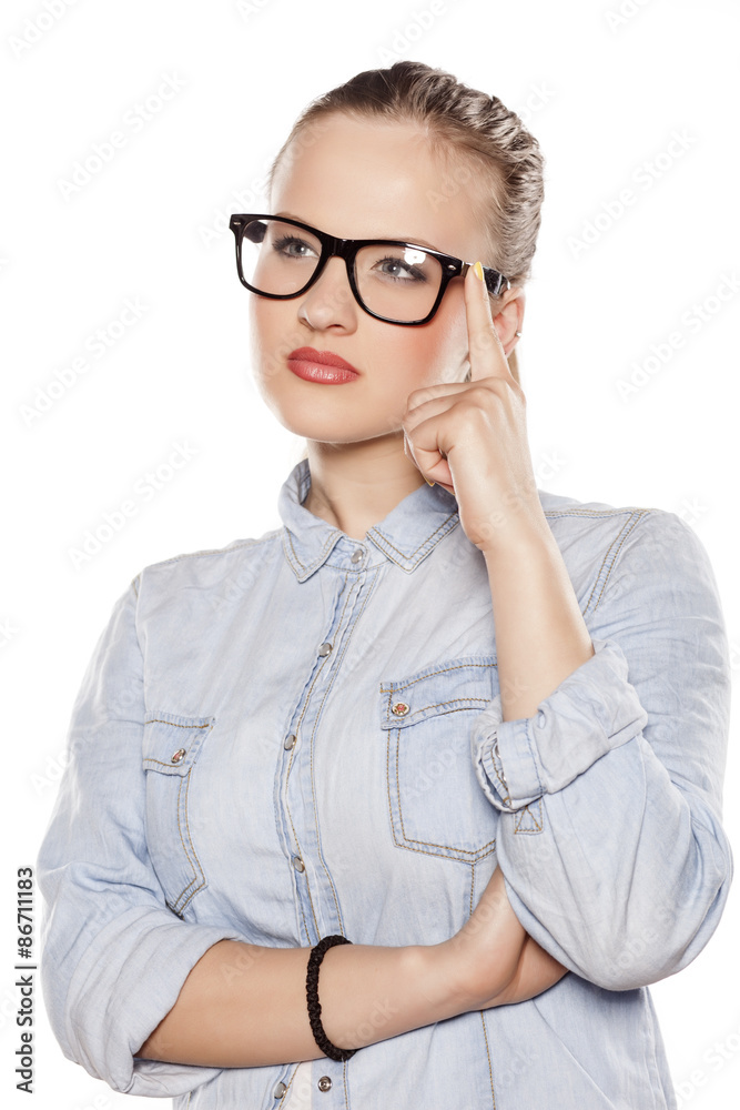 thoughtful young blonde with glasses thoughtful young blonde with glasses