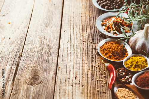 Colorful spices and on a wooden background