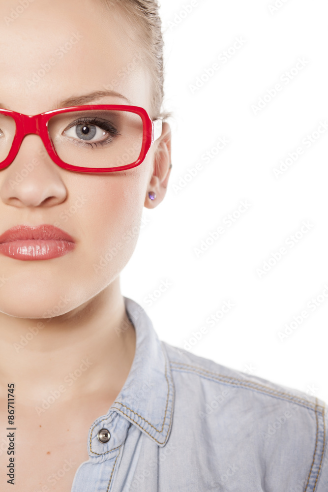 half portrait of young blonde with glasses on a white background