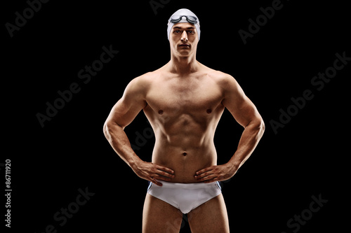 Cuadro en lienzo Handsome male swimmer in white swim trunks