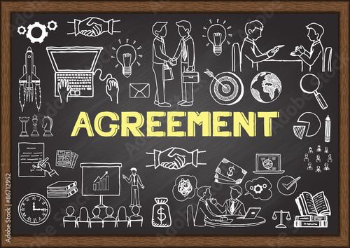 Doodles about agreement on chalkboard.