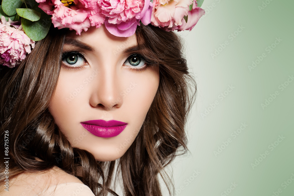 Beautiful Girl with Flowers. Face Closeup. Makeup and Hairstyle