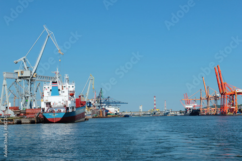 Port of Gdynia with cranes, gantrys and ships at piers, Poland