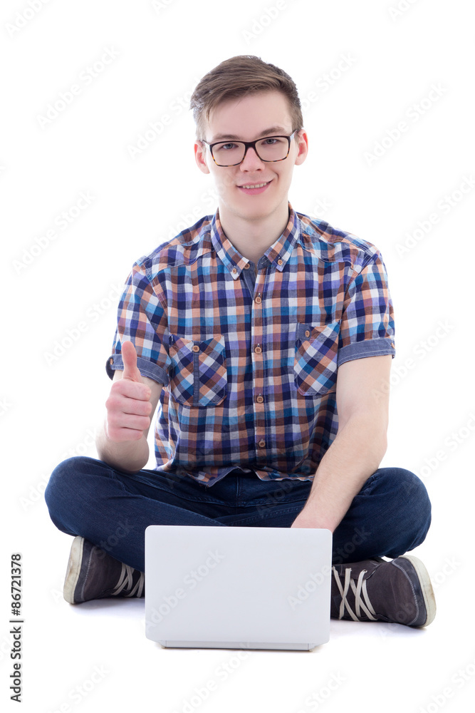 handsome teenage boy using laptop and thumbs up isolated on whit handsome teenage boy using laptop and thumbs up isolated on whit