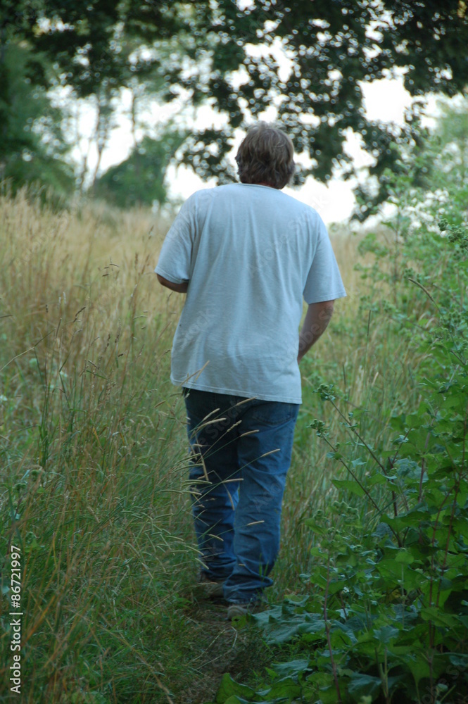 man walking in the woods man walking in the woods