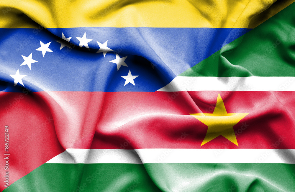 Obraz premium Waving flag of Suriname and Venezuela