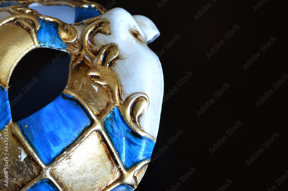 Venetian mask in the form of cat muzzle on dark background
