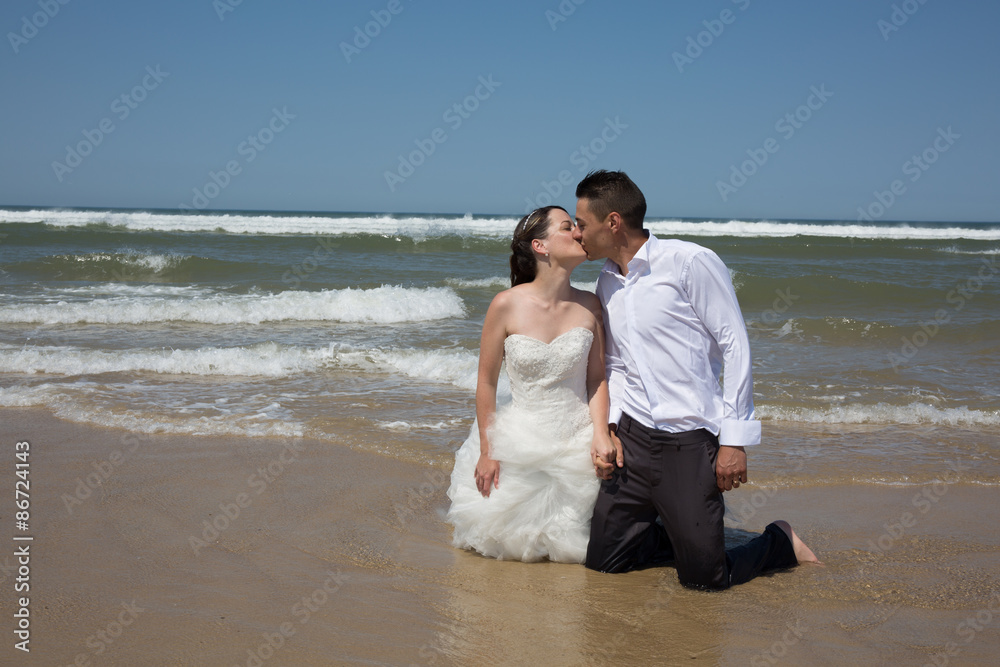 Beautiful couple at the beach happy together
