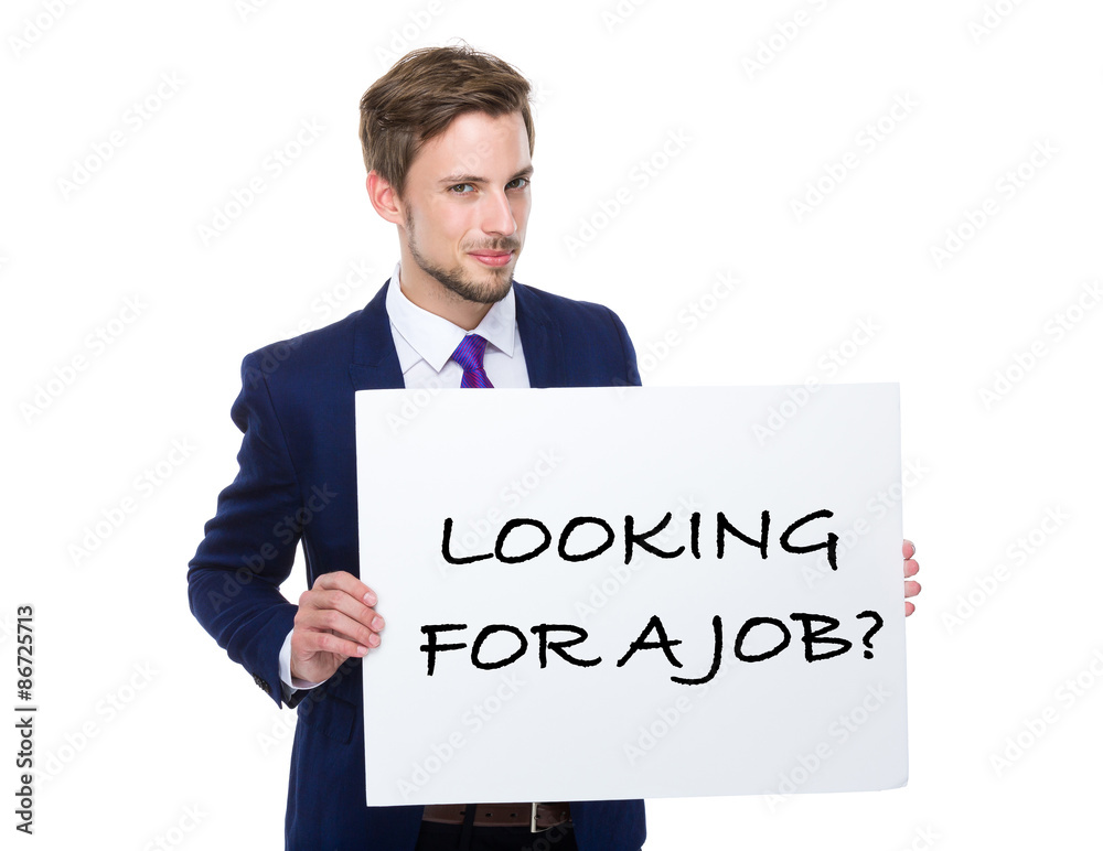 Businessman hold with white board showing phrase of looking for Businessman hold with white board showing phrase of looking for