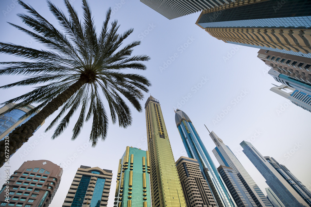 Obraz premium Sleek modern skyscrapers of the skyline along the business center of Sheikh Zayed Road in Dubai, UAE
