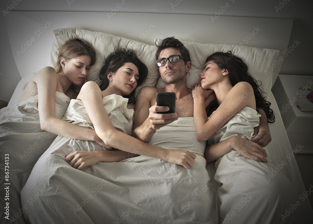 Man sleeping with three girls Stock Photo Adobe Stock