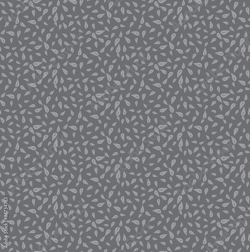 Vector seamless background consisting of random drops scattered in different directions. Chaotic drops on a gray background.
