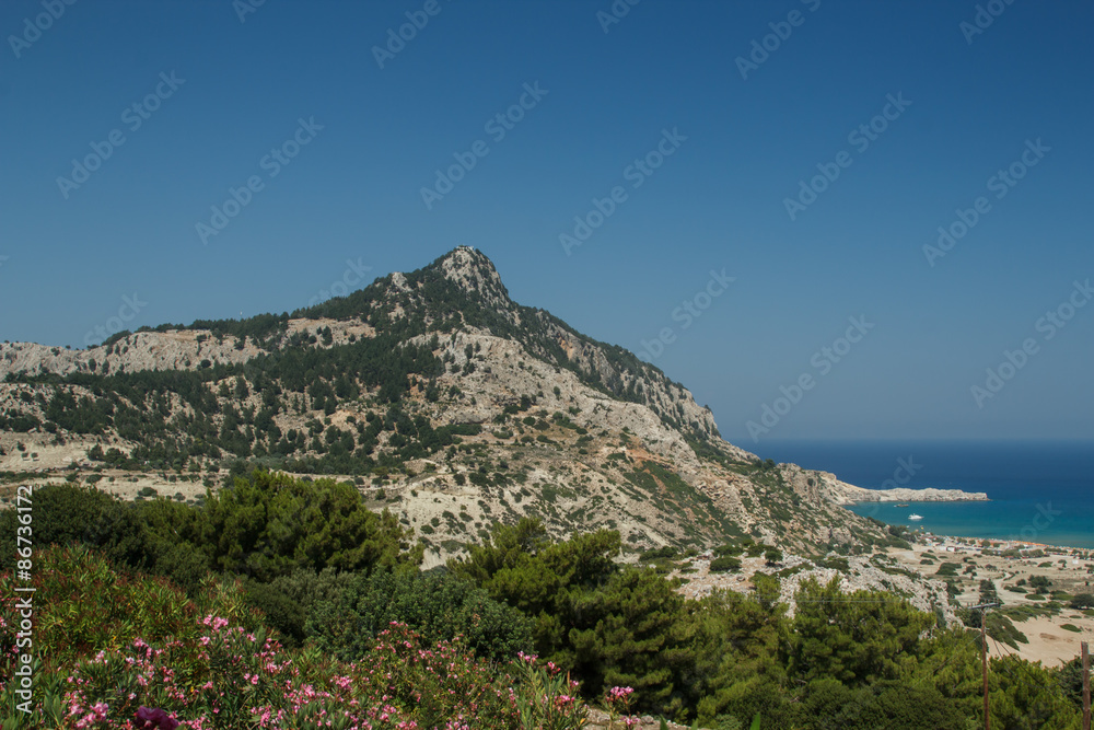 Mountain lagoon and sea with ships in Greece