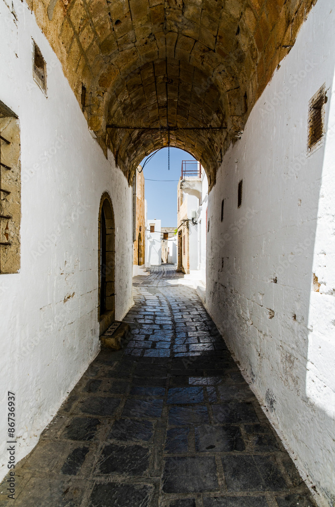 View of narrow street through the arch