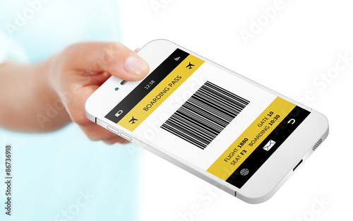 hand holding mobile phone with boarding pass isolated over white