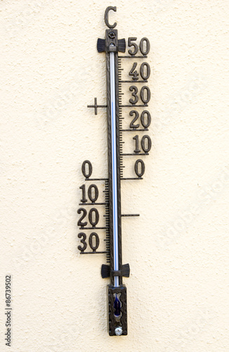 thermometer / Outdoor Thermometer on a yellow background photo