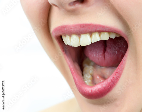 Closeup on mouth of females face, shouting