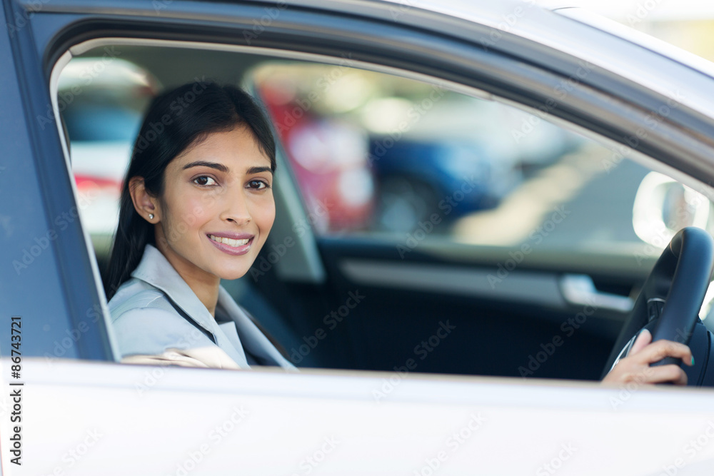 indian businesswoman inside her new car
