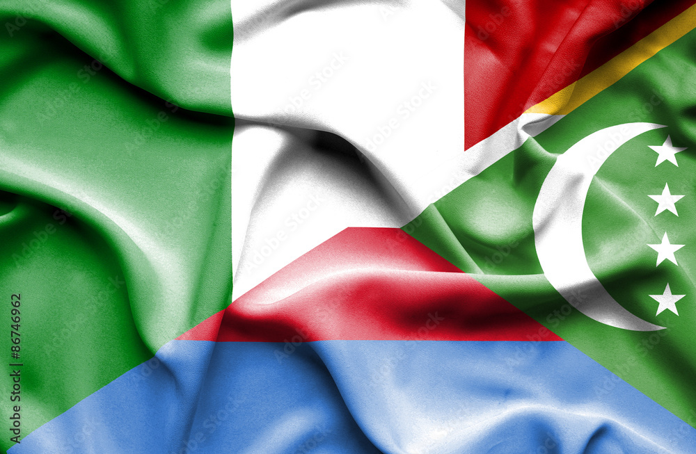 Obraz premium Waving flag of Comoros and Italy