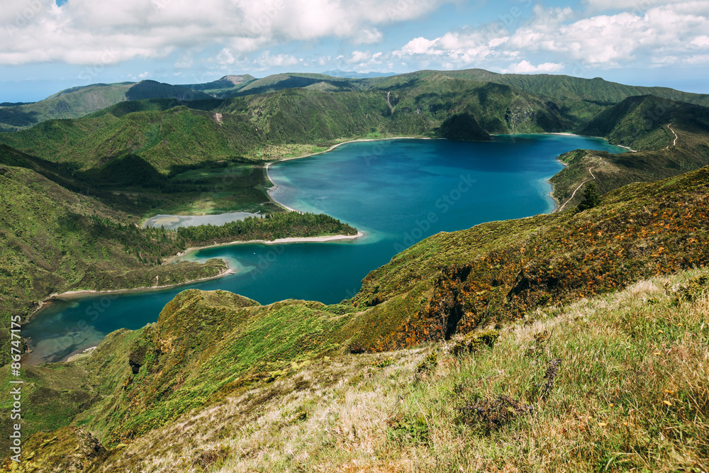 Panoramic view of Lagoa do Fogo, a crater lake within the Agua de Pau Massif stratovolcano in the center of the island of Sao Miguel in the Portuguese archipelago of the Azores.