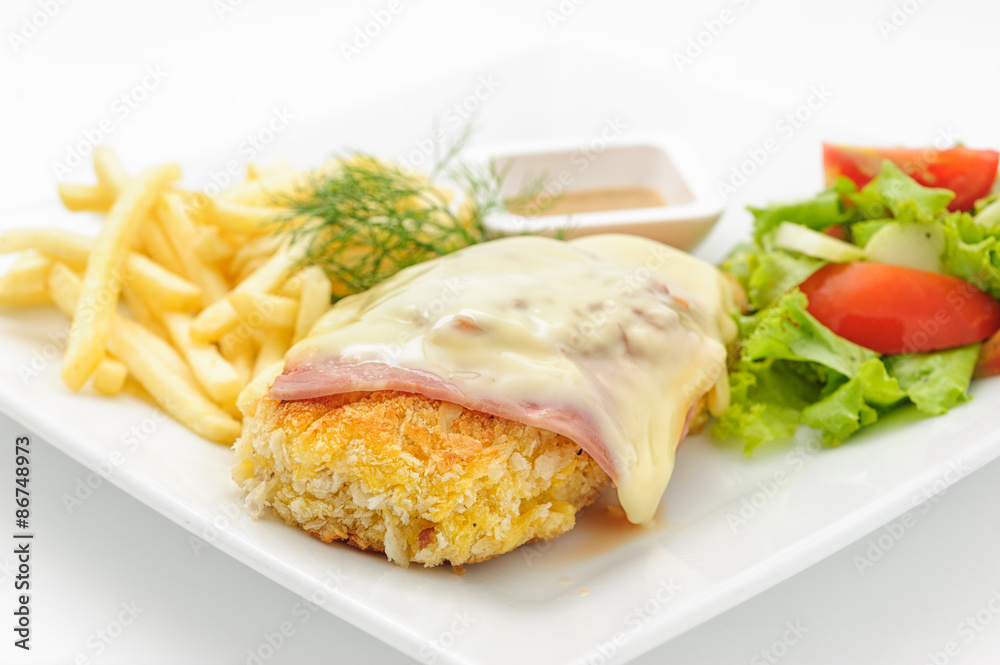 Chicken cutlet with ham and cheese isolated on white. Chicken cutlet with ham and cheese isolated on white.