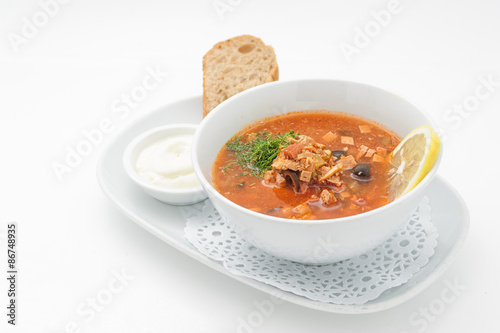 Russian traditional soup with mixed meat isolated on white.