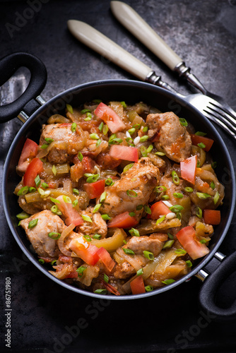 Chicken stew with onion, pepper ant tomato
