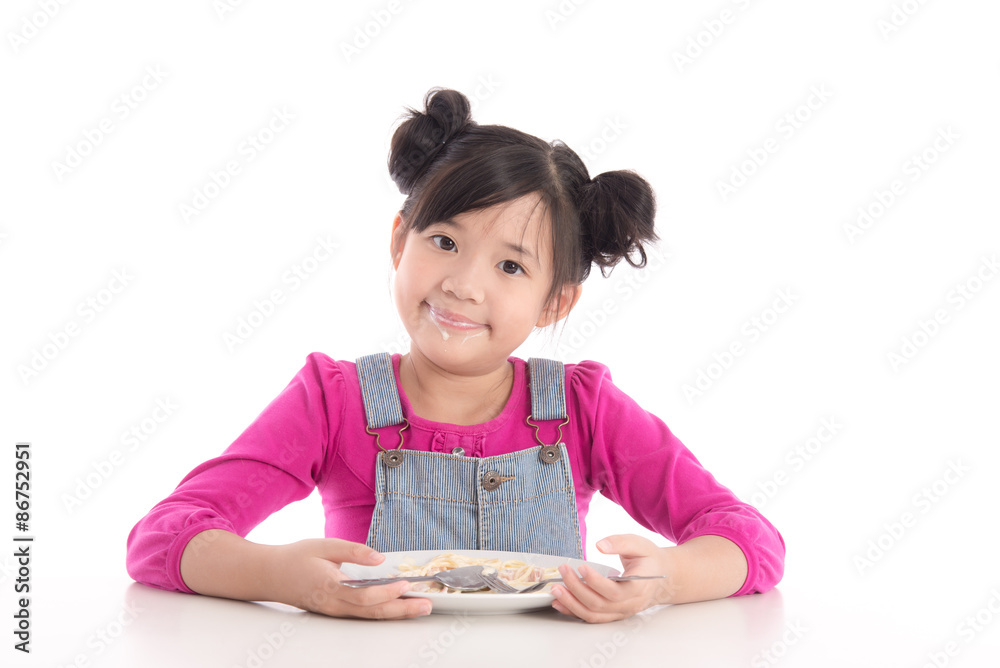 Cute asian girl eating Spaghetti Carbonara Cute asian girl eating Spaghetti Carbonara