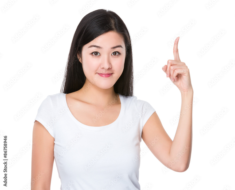 Asian young woman with finger point upwards Asian young woman with finger point upwards