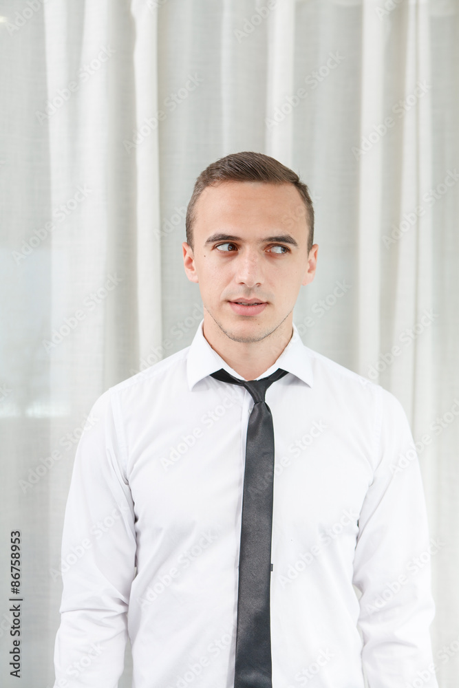 Portrait of a businessman looking aside in office Portrait of a businessman looking aside in office