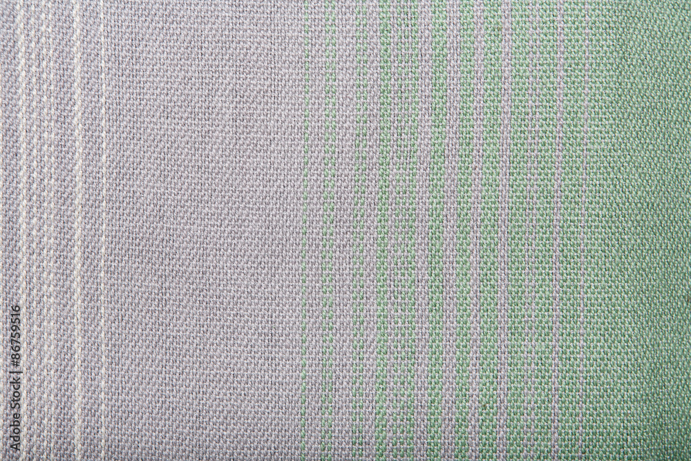 Fototapeta premium Handmade fabric with green and gray striped texture. Clothes background