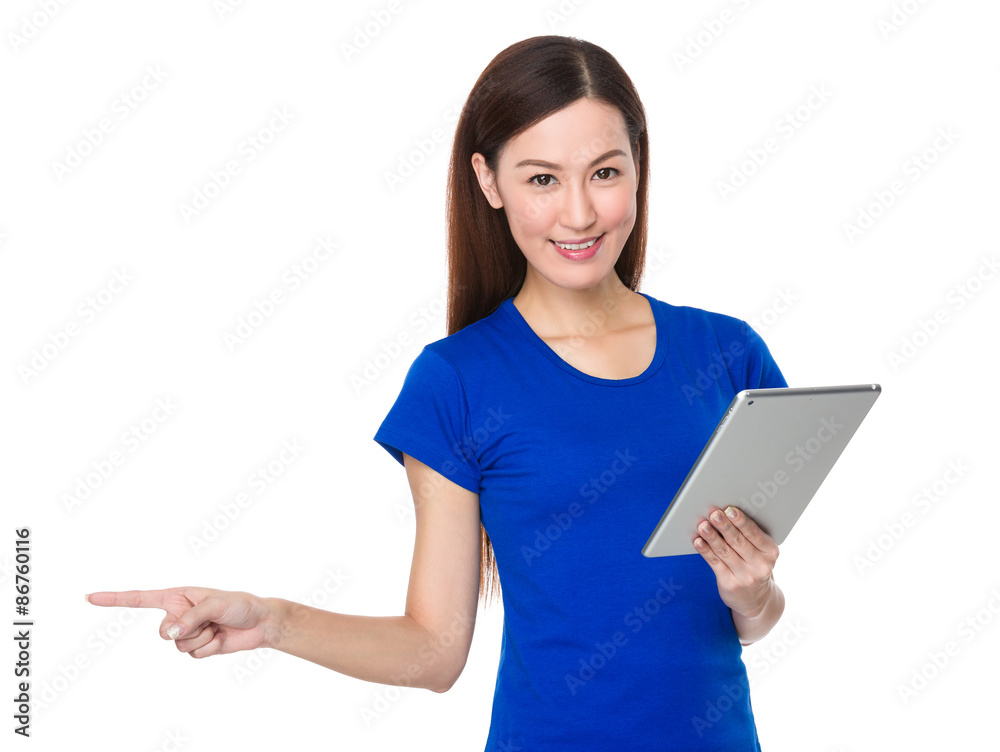 Woman use of tablet and finger point aside Woman use of tablet and finger point aside