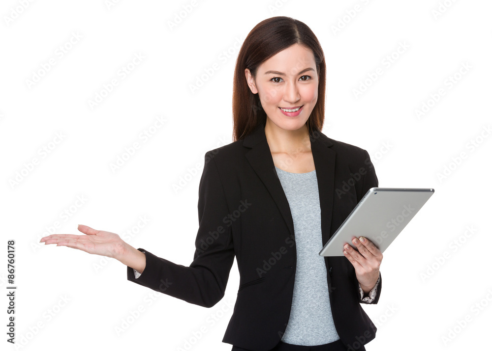 Asian Businesswoman use of the tablet pc and open hand palm Asian Businesswoman use of the tablet pc and open hand palm