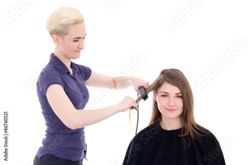 blonde woman hair stylist doing haircut to beautiful woman isola