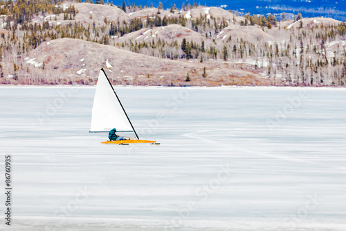 Ice-boat sailing frozen Lake Laberge Yukon Canada