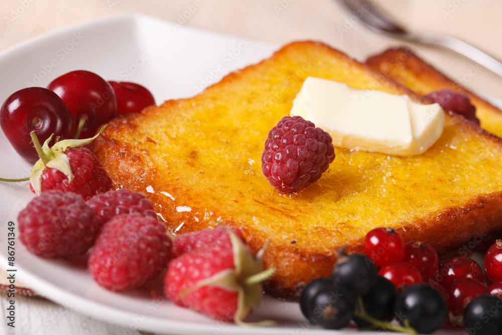 sweet French toast with syrup and fresh berries close-up sweet French toast with syrup and fresh berries close-up