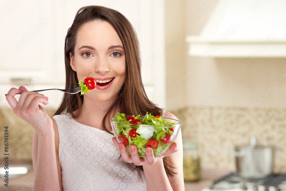 beautiful girl in a kitchen eating healthy food beautiful girl in a kitchen eating healthy food