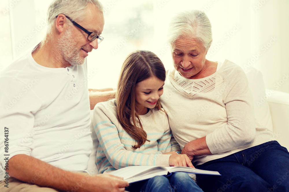 smiling family with book at home smiling family with book at home