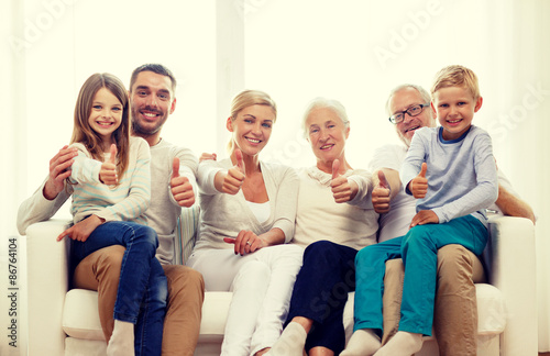 happy family sitting on couch at home