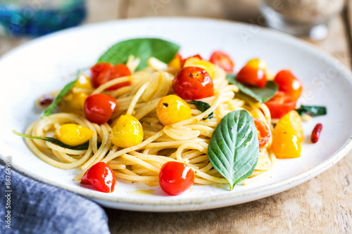 Spaghetti with red and yellow cherry tomato